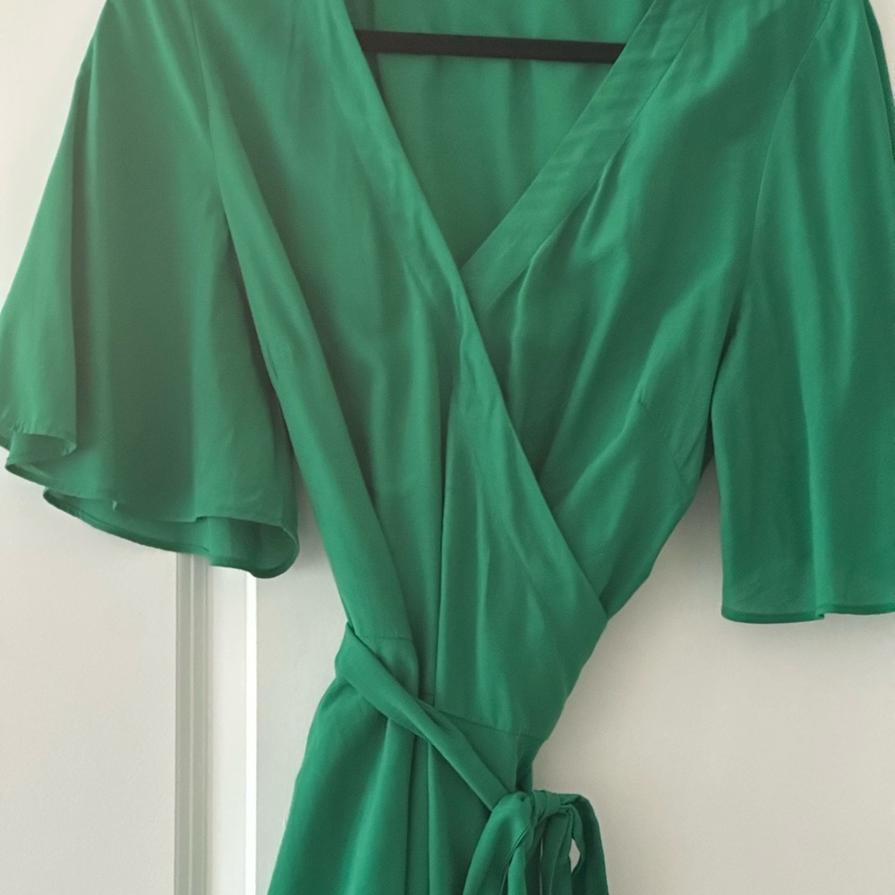 Emerald green peplum wrap blouse